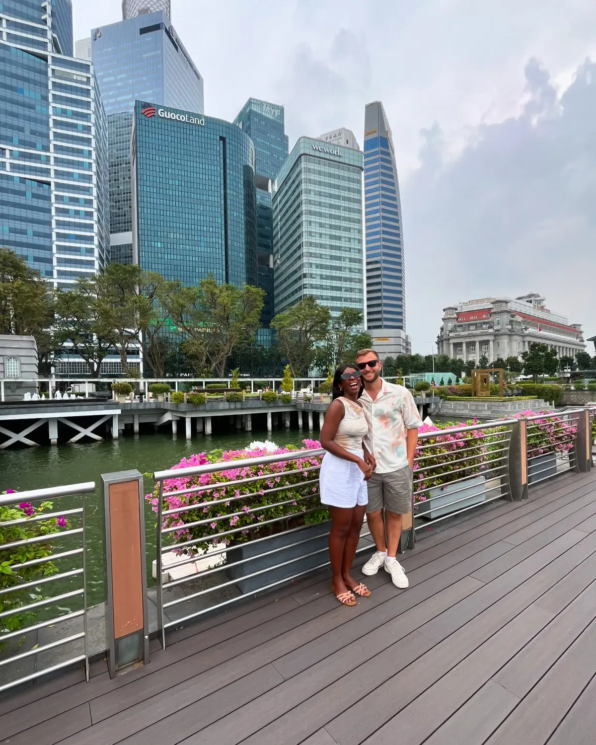Us on the riverside promenade with the CBD behind