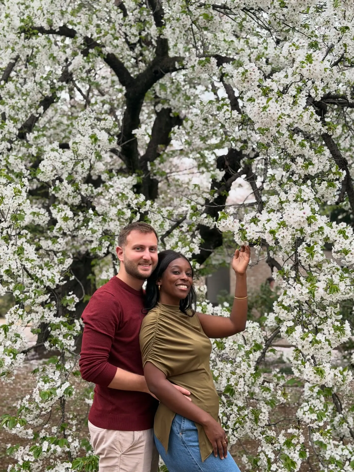 Us among white cherry blossoms in a Tokyo park