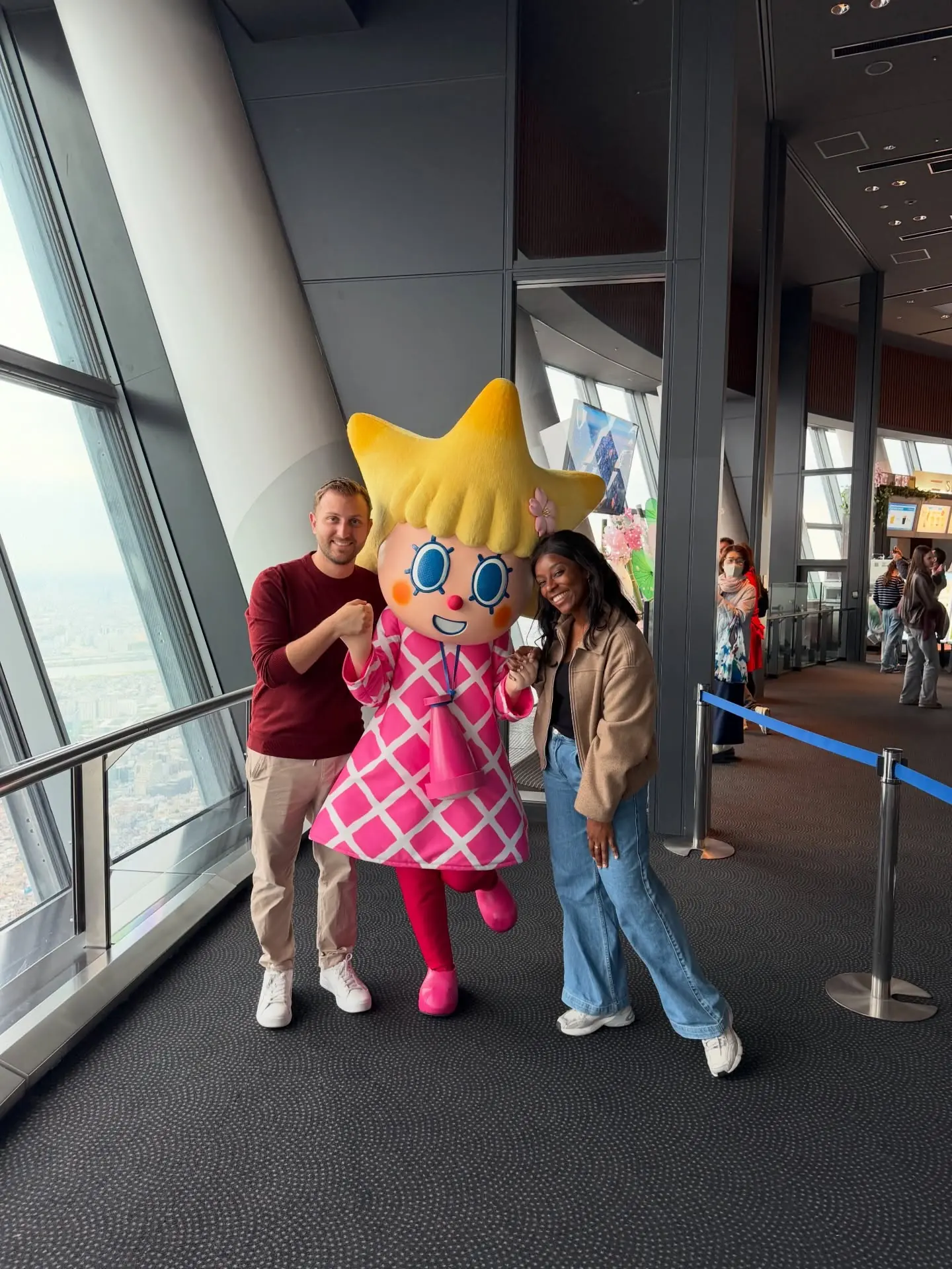 Us with a mascot high up on the Tokyo Skytree observation deck