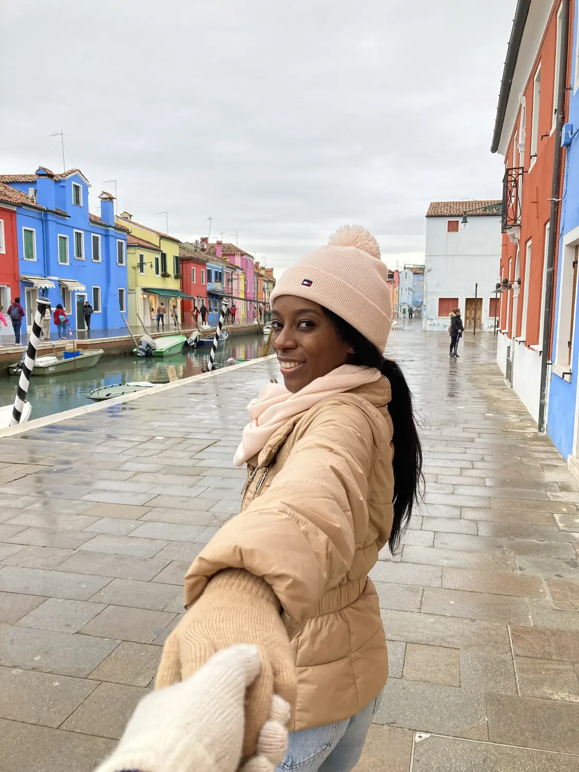 Melody on a street of colourful houses on Burano island