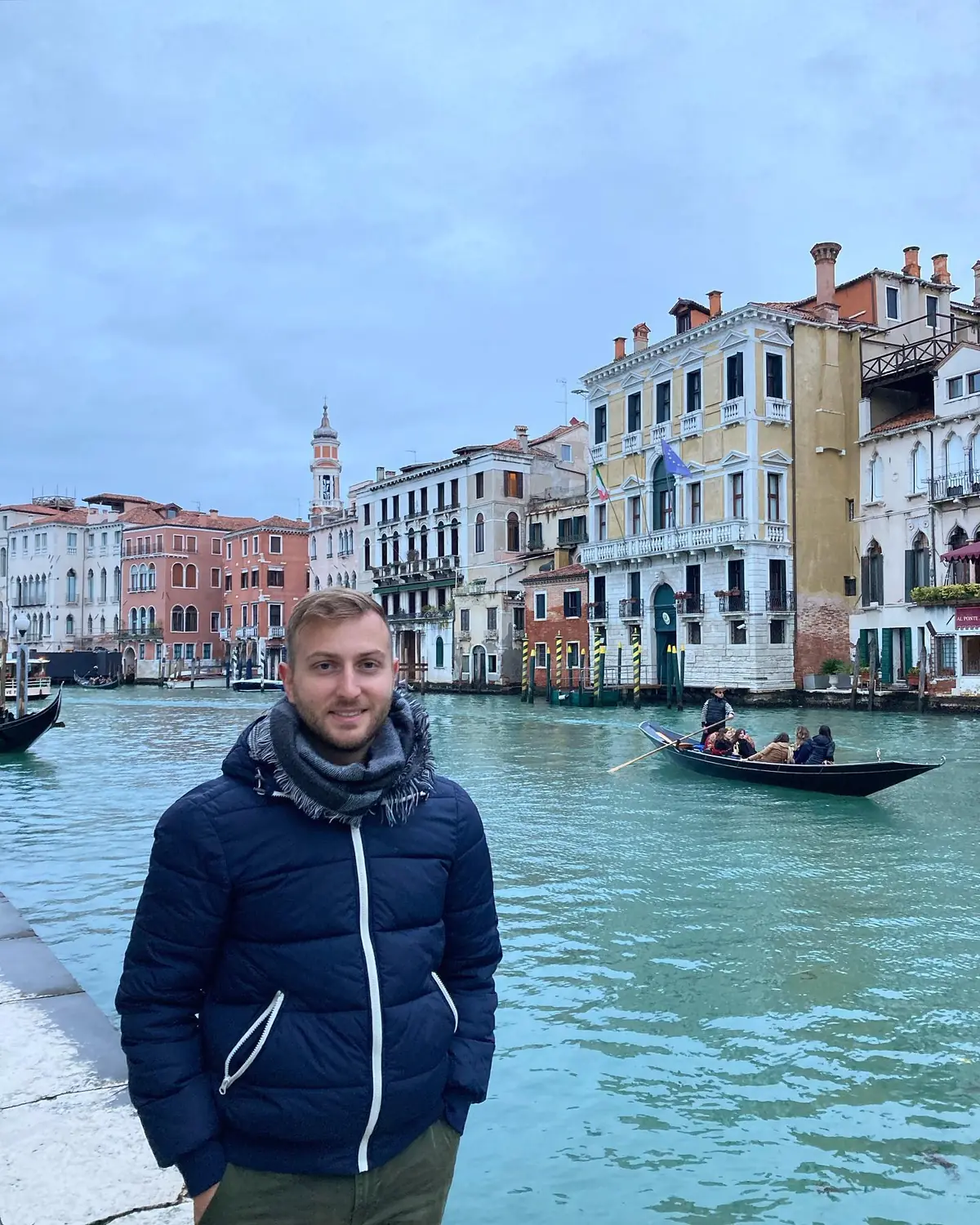 Andrew on the edge of the Grand Canal in Venice